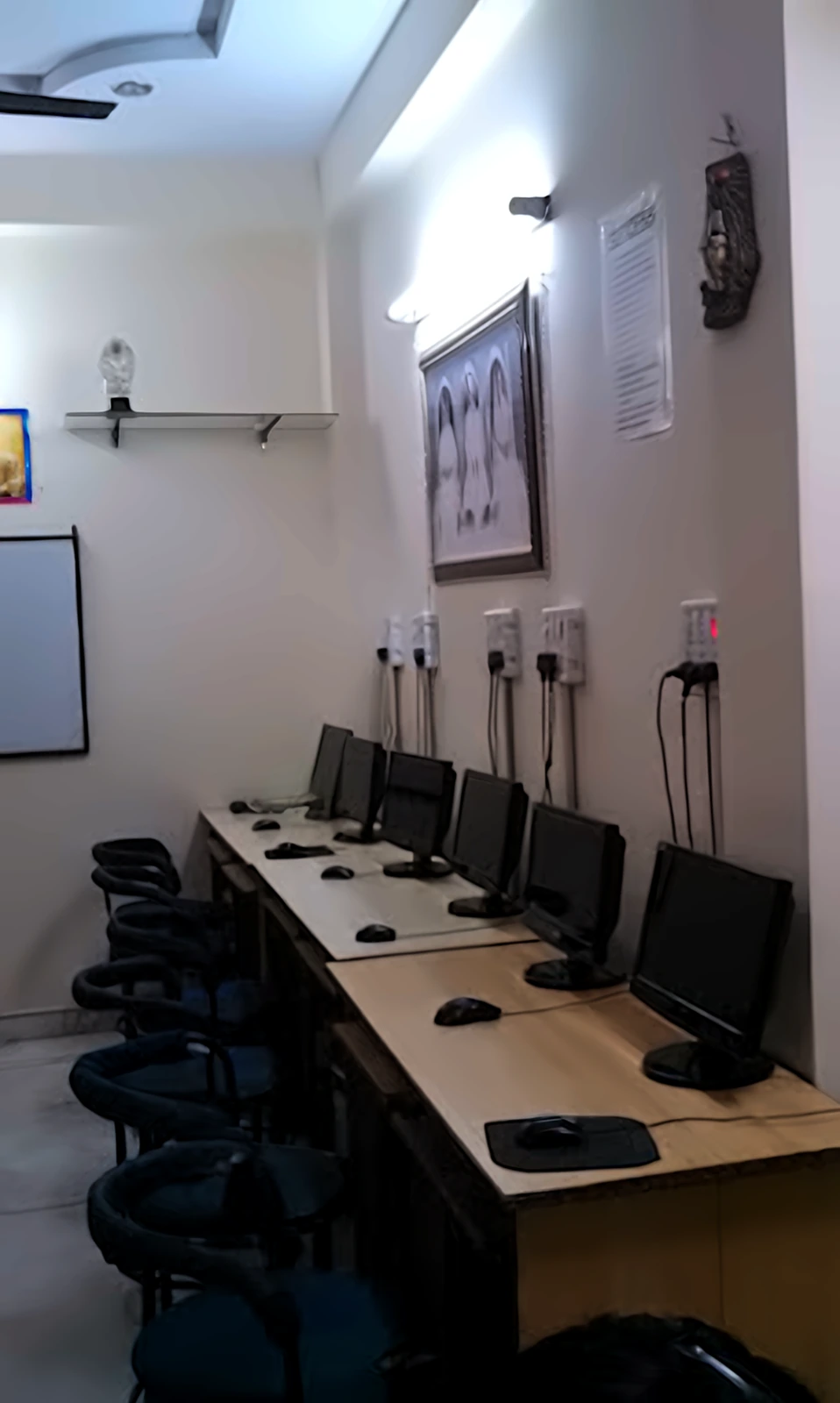 Row of computer workstations ready for a practical batch