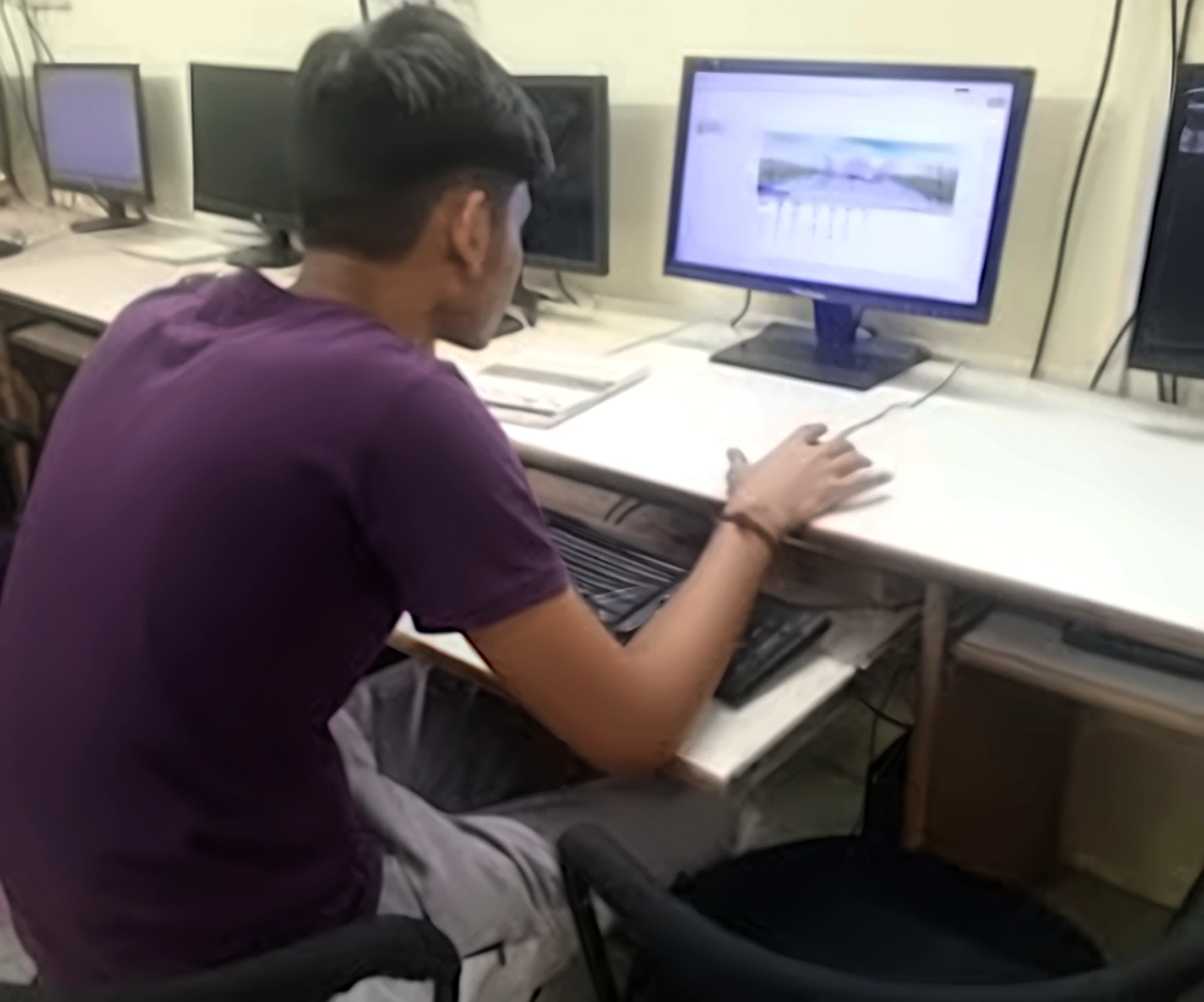 Student practising computer applications at SK Institute