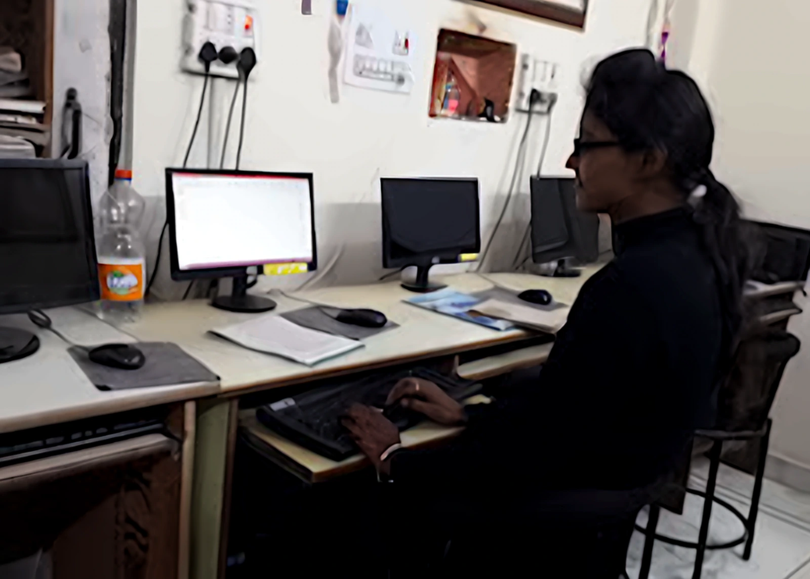 Student working on a desktop computer during a training session